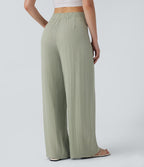 Pantalon large et fluide aspect lin taille haute, boutonné avec poches