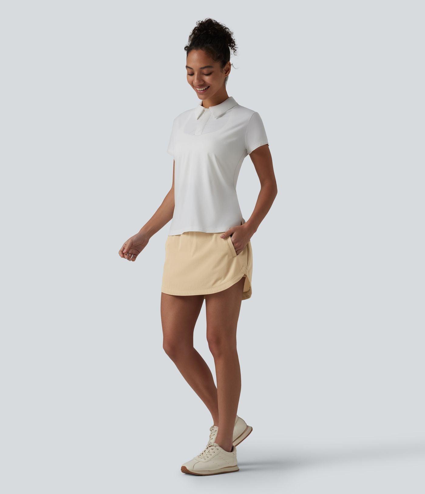 Jupe de golf 2-en-1 taille ultra haute ventre plat avec ourlet arrondi et poches