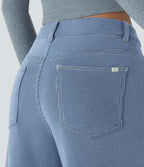 Jean décontracté taille basse en maille gaufrée extensible, jambe large avec poches multiples et fermeture zippée