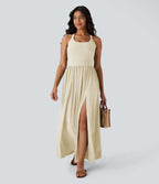 Robe longue fluide fendue avec poches latérales, dos nu et effet torsadé