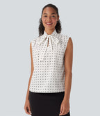 Chemise de travail sans manches à pois avec nœud devant