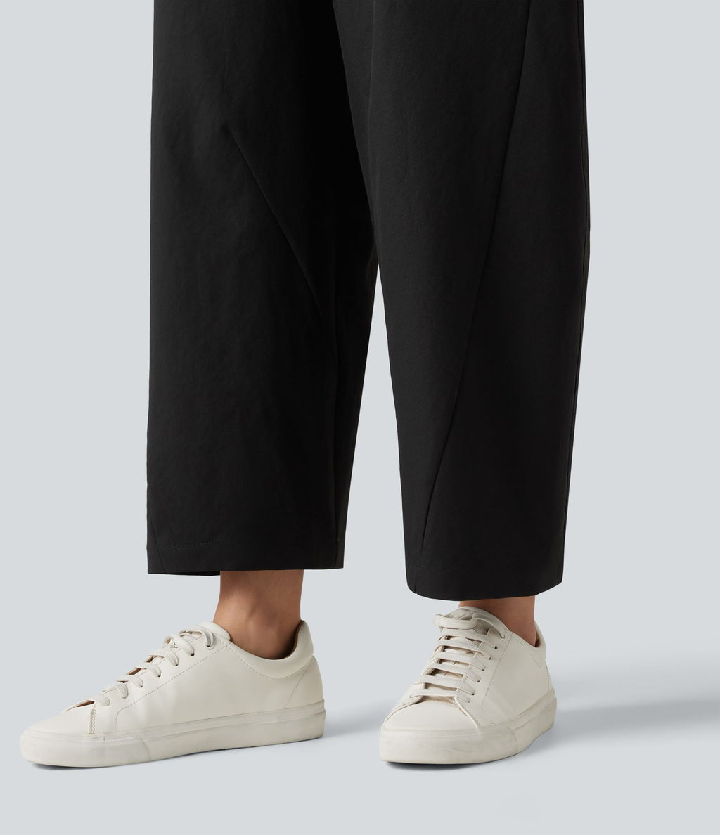 Pantalon décontracté à taille mi-haute, coupe ample et jambes fuselées, avec poches