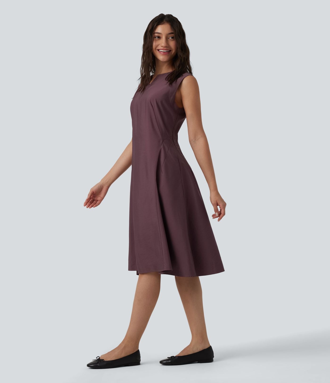 Robe mi-longue évasée de travail col cranté sans manches avec poches