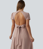 Robe mariage maxi fluide col V à manches courtes, dos nu avec lien noué et brassière intégrée