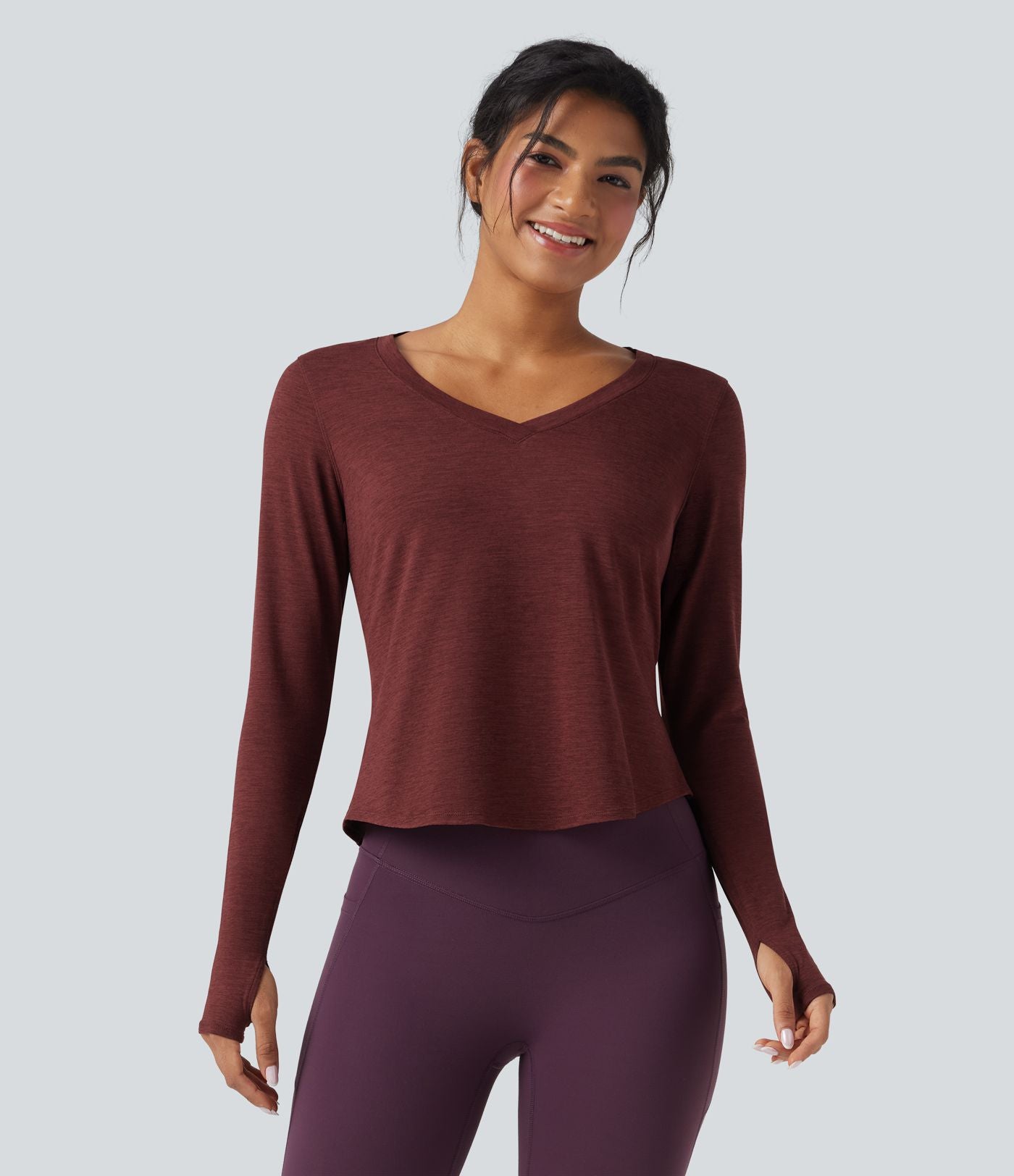Top de sport yoga chiné col V manches longues avec trous pouces ourlet arrondi