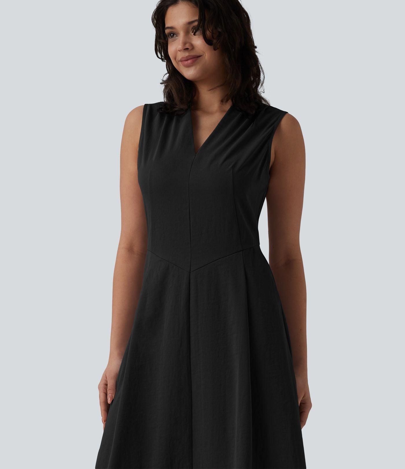 Robe mi-longue plissée col V sans manches avec fermeture éclair invisible et poches pour le travail