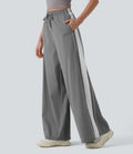 Pantalon running large à rayures taille haute avec cordon de serrage, séchage rapide et effet frais InstantCool avec poches, protection solaire UPF40+