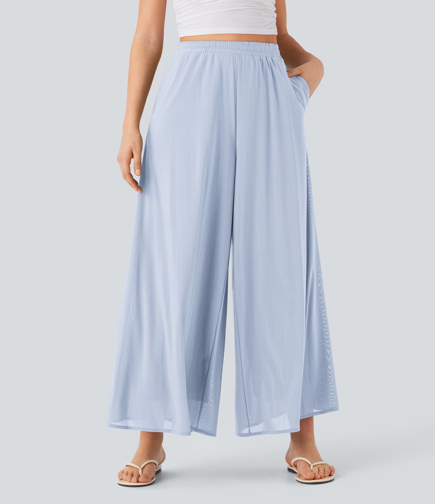 Pantalon fluide et ample avec superposition en mesh, poches latérales et taille haute