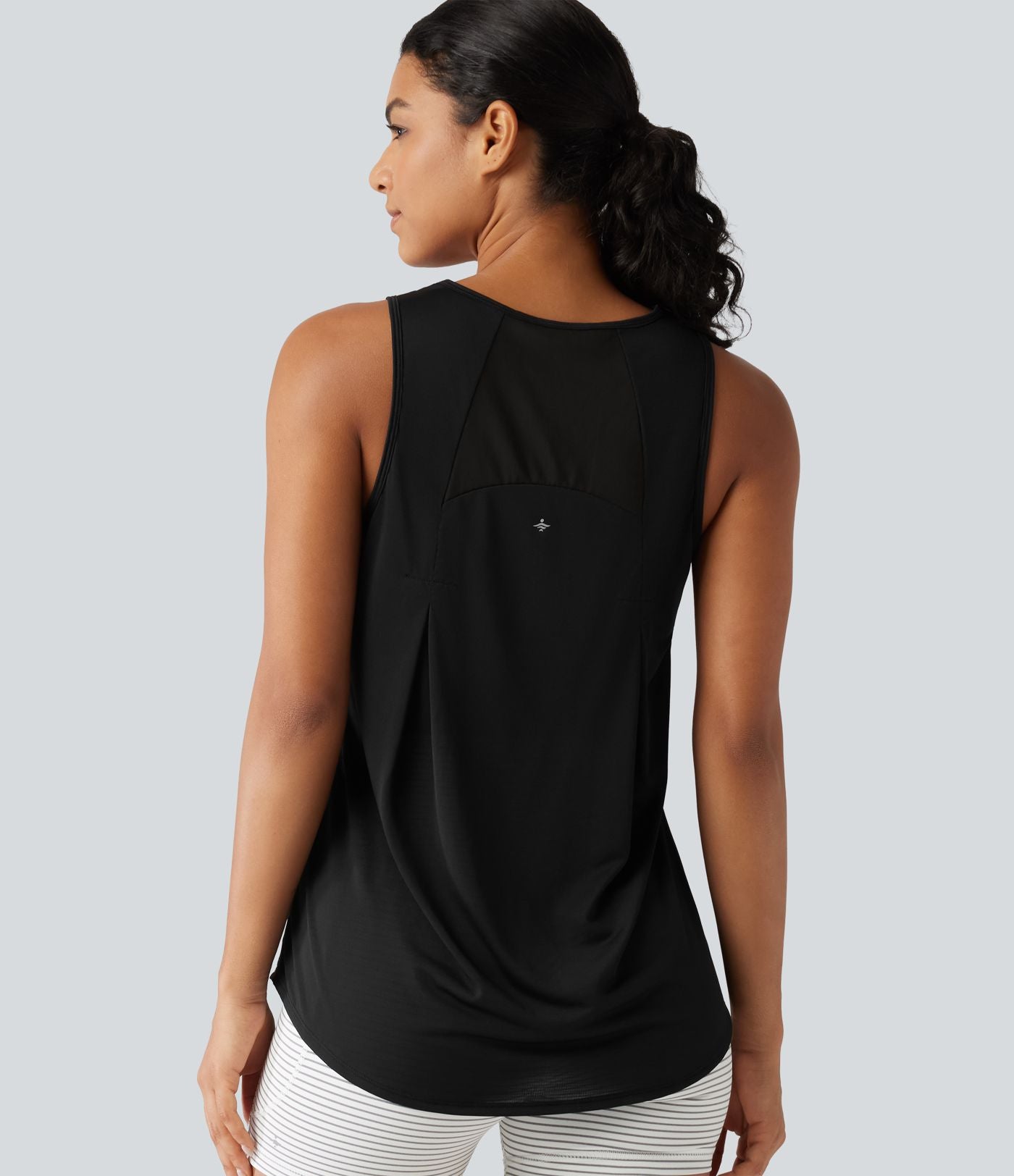 Débardeur de running longueur allongée en mesh contrasté avec ourlet arrondi