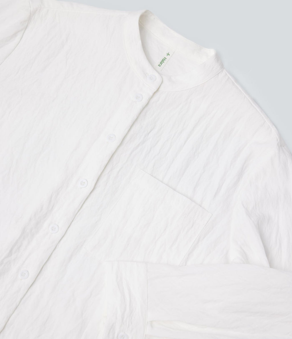 Chemise décontractée manches longues ourlet arrondi avec poche