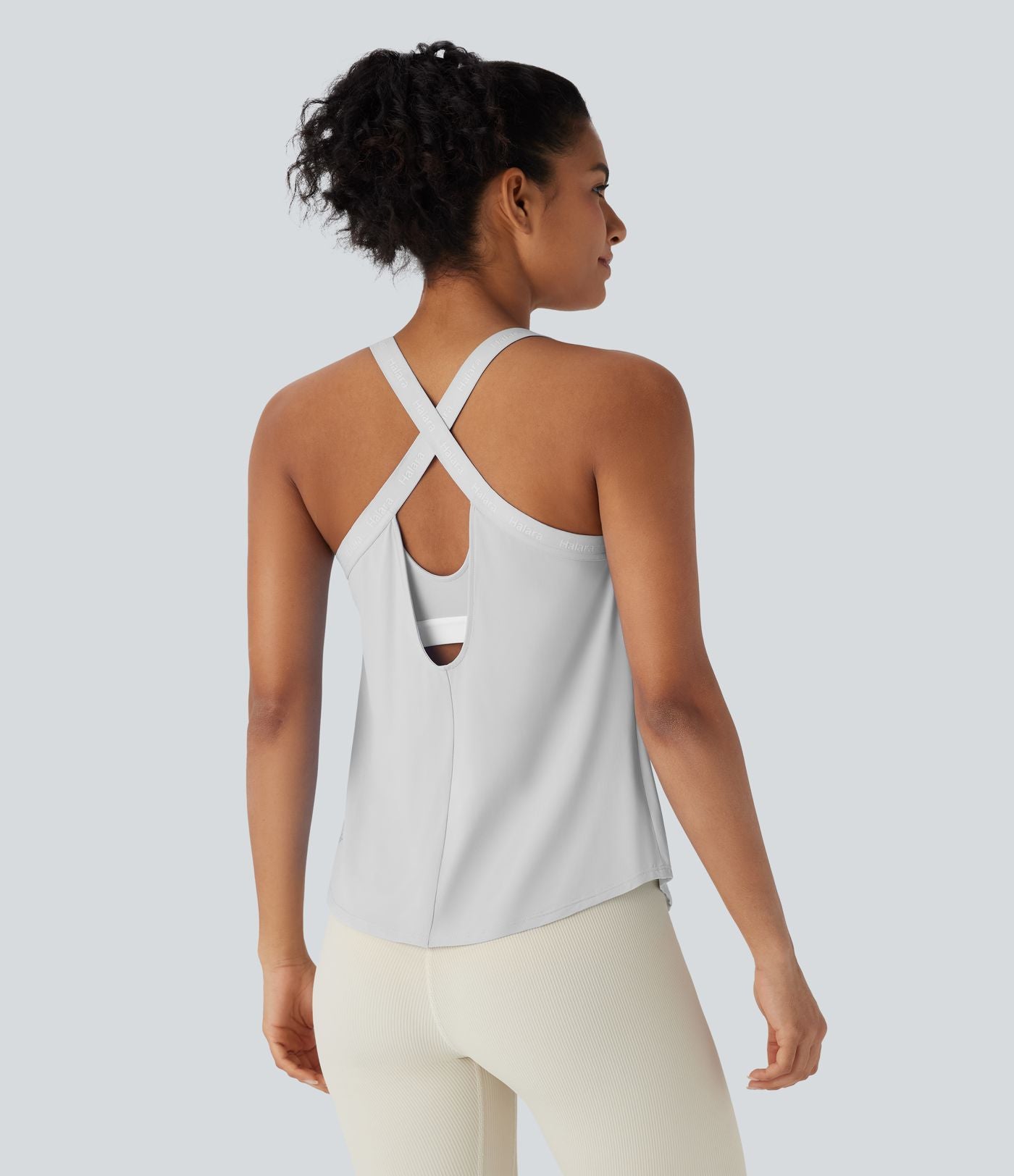 Débardeur yoga dos nu col U avec bretelles croisées, ourlet arrondi et effet frais InstantCool, protection solaire UPF50+