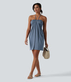 Robe resort mini dos nu à col licou avec lien noué dans le dos et poches