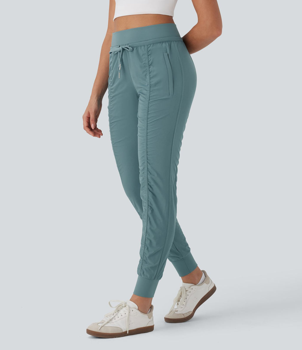 Pantalon jogging de voyage taille haute avec cordon de serrage, coupe fuselée et poches latérales zippées