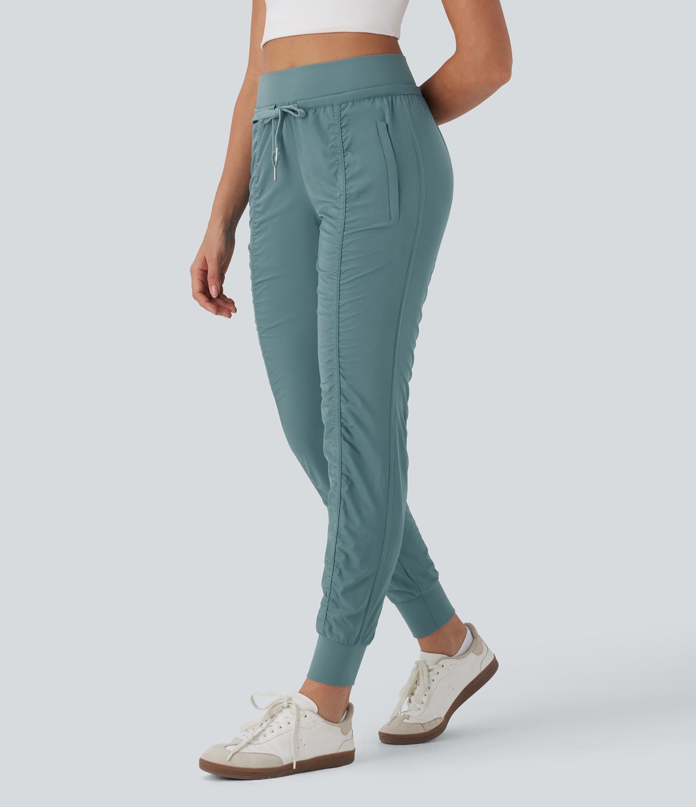 Pantalon jogging de voyage taille haute avec cordon de serrage, coupe fuselée et poches latérales zippées