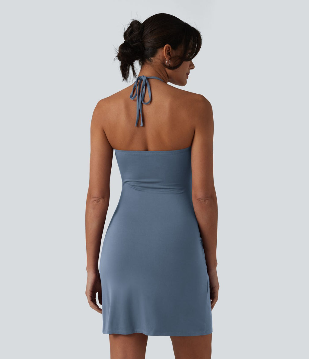 Robe resort mini dos nu à col licou avec lien noué dans le dos et poches
