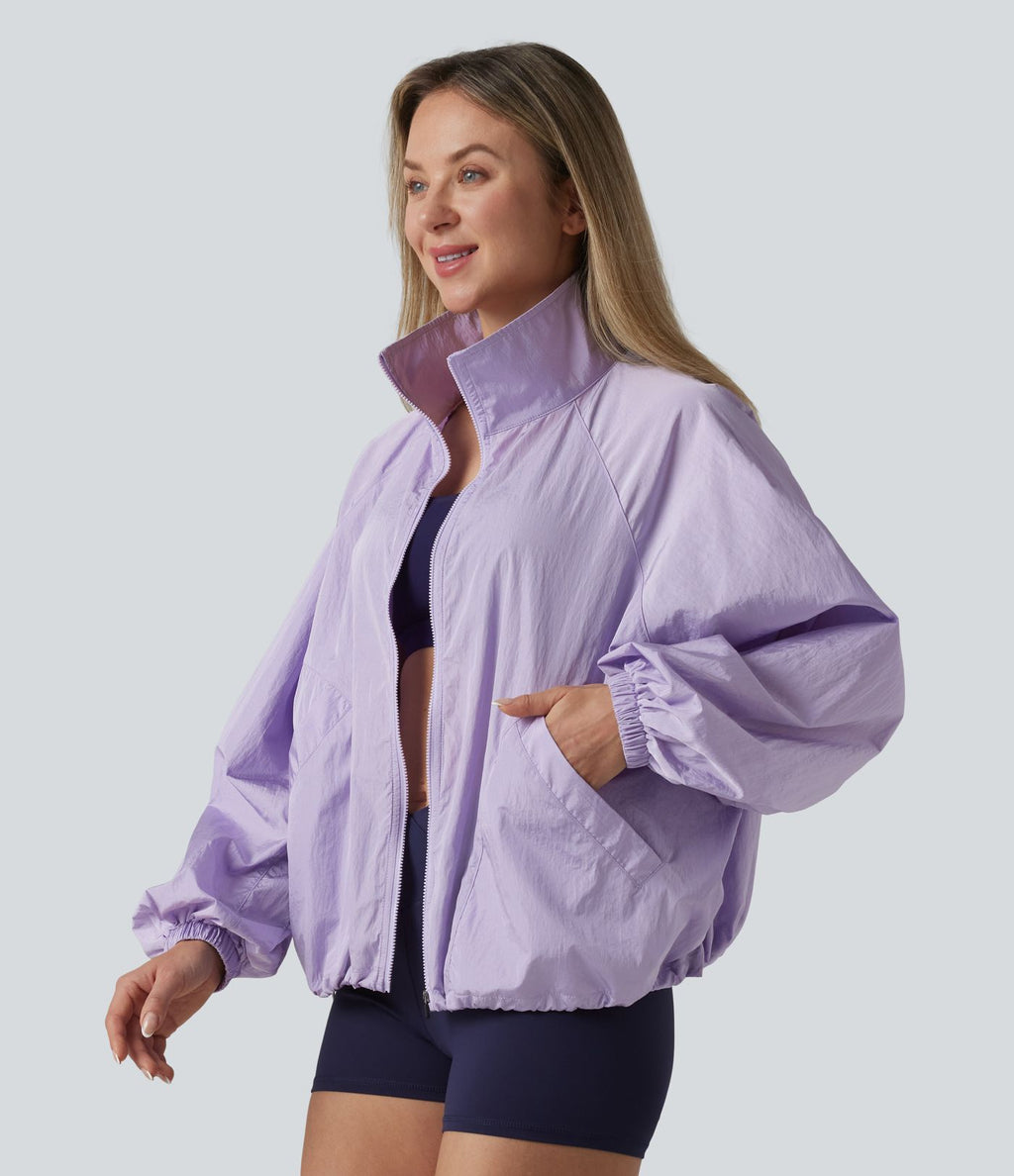 Veste de sport déperlante col montant manches longues zippée avec poches