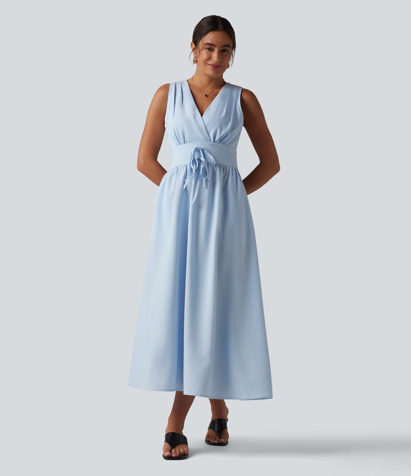 Robe midi rayée sans manches à col en V et poches