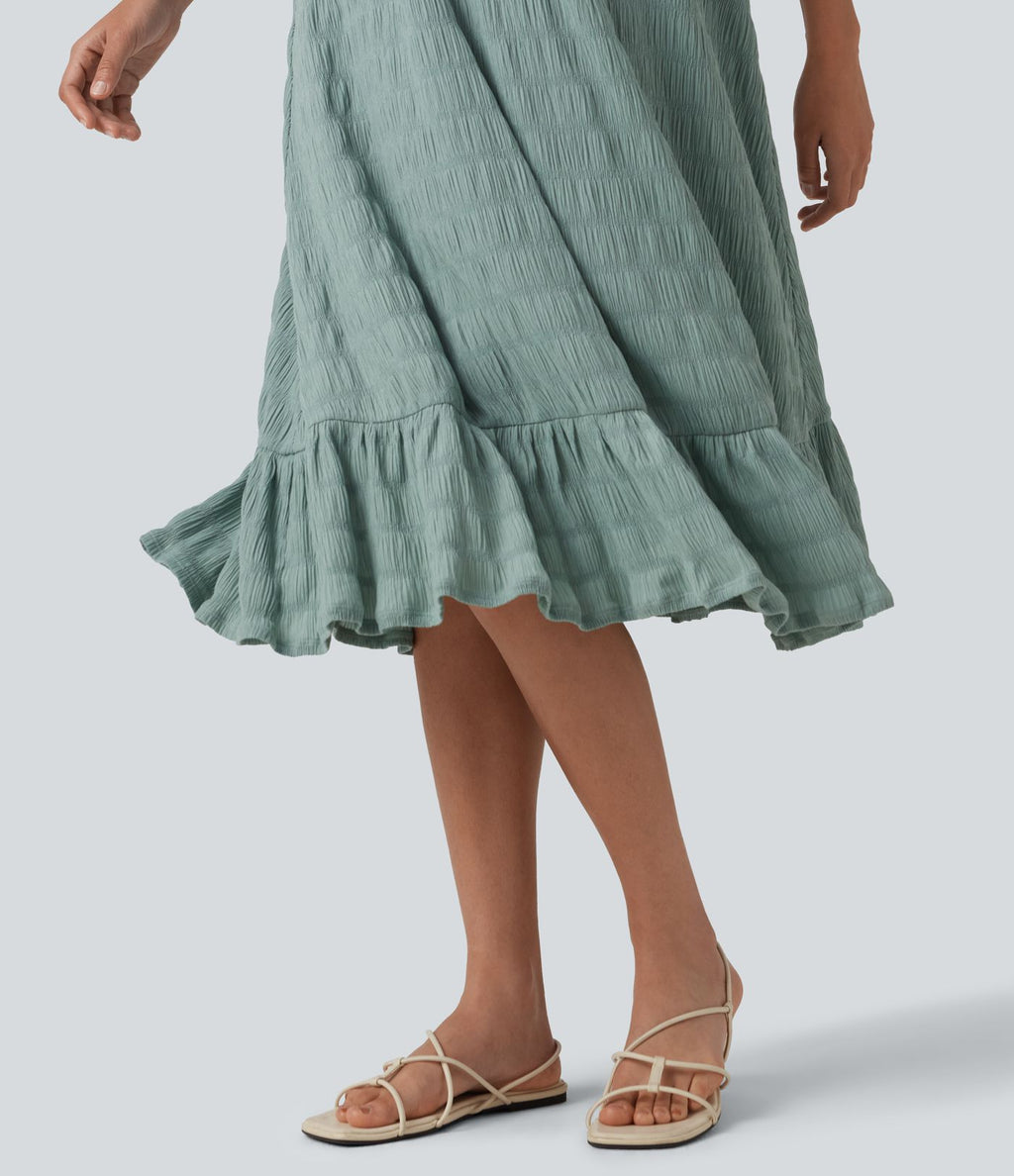 Robe midi sans manches à encolure arrondie avec coussinets amovibles et ourlet à volants