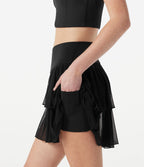 Jupe-short tennis mini fluide taille haute croisée en mesh à volants, avec poches