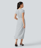 Robe midi à pois col V avec manches courtes, lien côté et poches