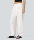 Pantalon tailleur ample, taille moyenne, coupe barrel, à poches