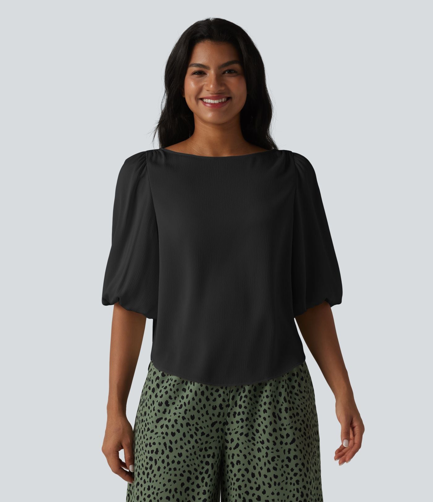 Blouse décontractée à manches bouffantes et ourlet arrondi texturé