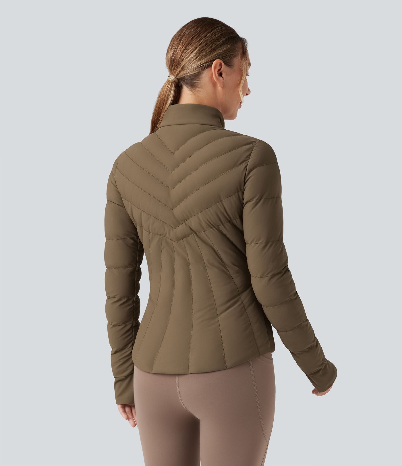 Doudoune de sport extensible col montant avec passants pouces et poches