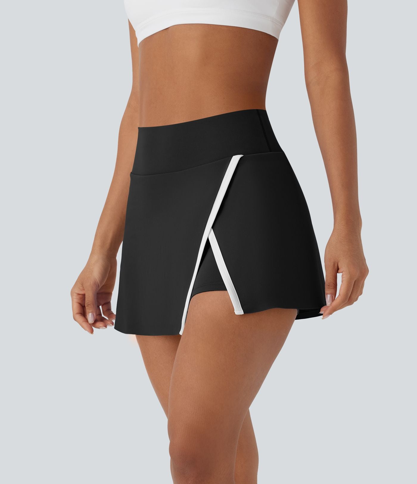Jupe de tennis mini 2-en-1 à taille haute, fente, blocs de couleur et poche latérale