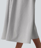 Robe midi rayée sans manches à col en V et poches