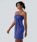 Robe resort mini dos nu à col licou avec lien noué dans le dos et poches