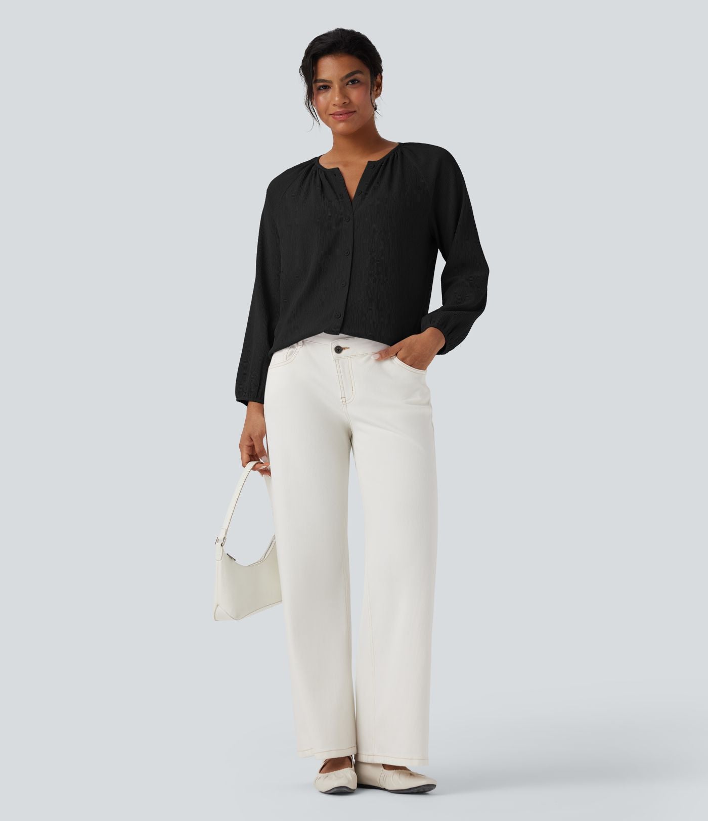 Blouse texturée col rond manches longues ourlet arrondi
