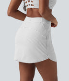 Jupe de golf mini moulante 2-en-1 taille haute à rayures avec poches