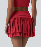 Jupe de danse mini 2-en-1 en mesh respirant à volants et ourlet asymétrique taille haute avec poches