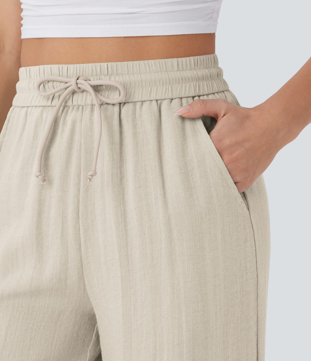 Pantalon large fluide taille haute avec cordon de serrage, poches latérales et aspect lin