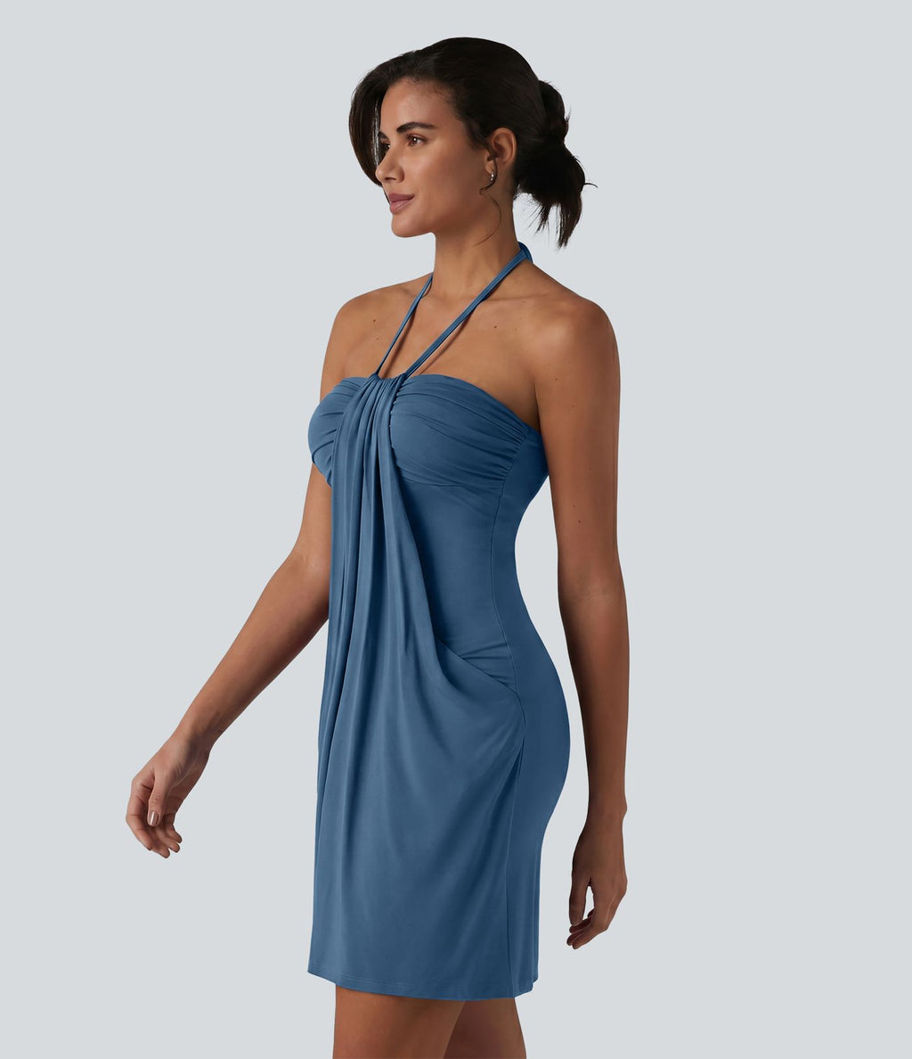 Robe resort mini dos nu à col licou avec lien noué dans le dos et poches