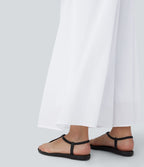 Pantalon fluide et ample avec superposition en mesh, poches latérales et taille haute
