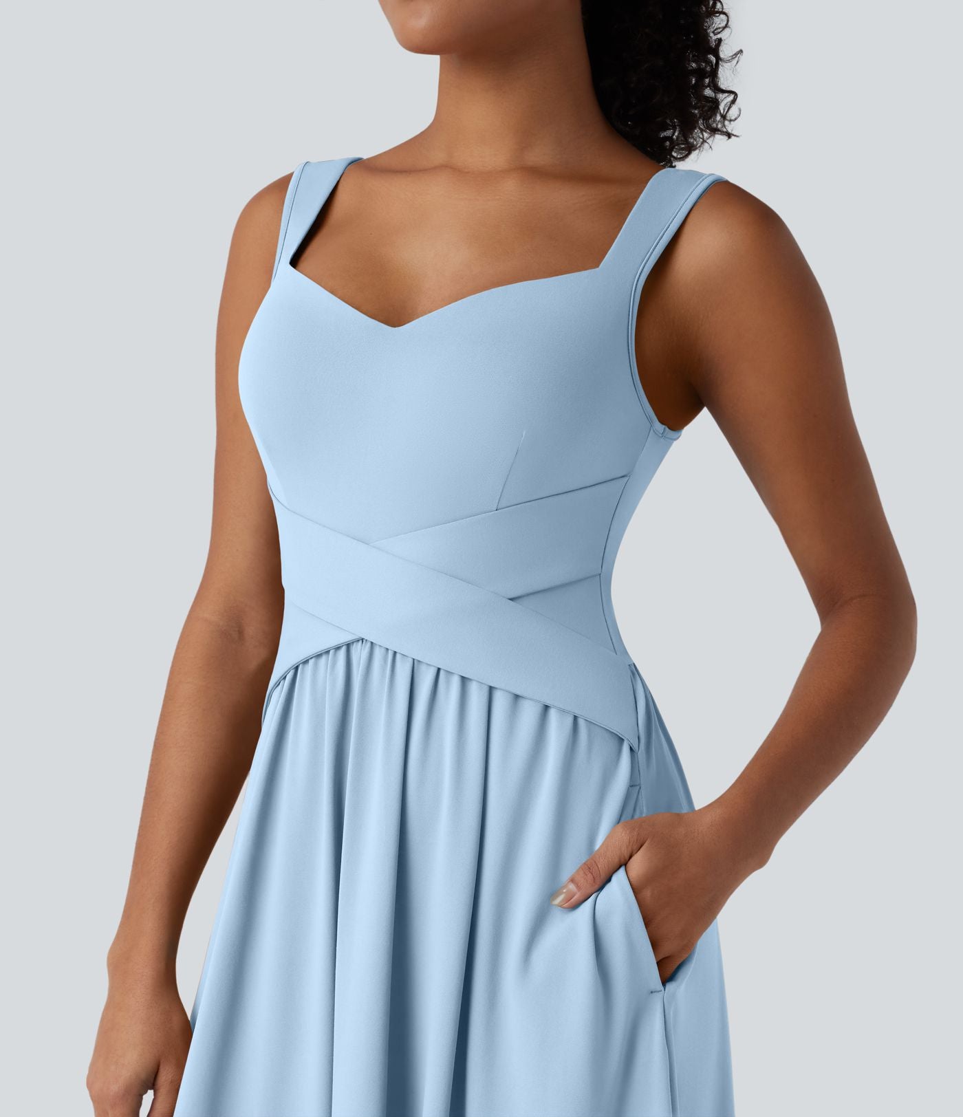 Robe midi fluide sans manches dos croisé ouvert avec poches