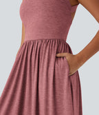 Robe longue fluide fendue avec poches latérales, dos nu et effet torsadé