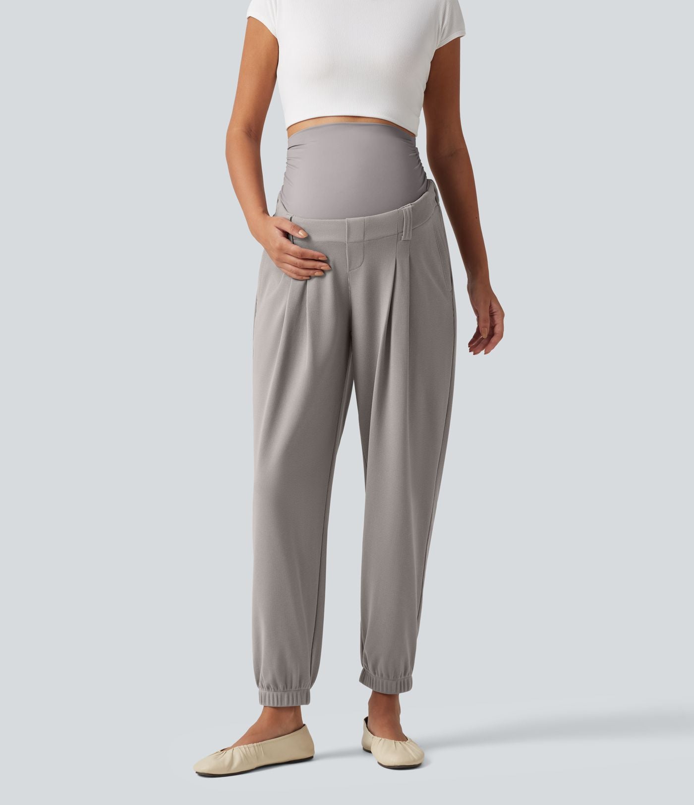 Pantalon de grossesse fuselé taille très haute en tissu gaufré avec poches