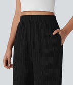 Pantalon tailleur décontracté à taille haute, jambes droites, texture froissée et poches latérales