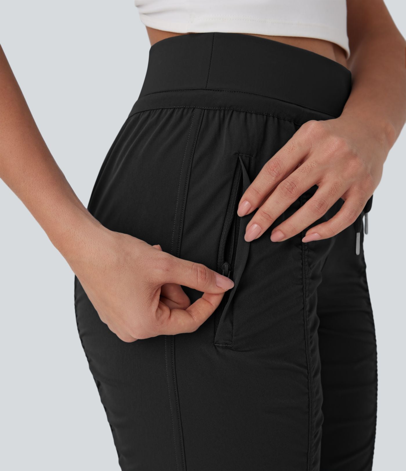 Pantalon jogging de voyage taille haute avec cordon de serrage, coupe fuselée et poches latérales zippées
