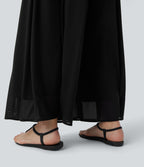 Pantalon fluide et ample avec superposition en mesh, poches latérales et taille haute