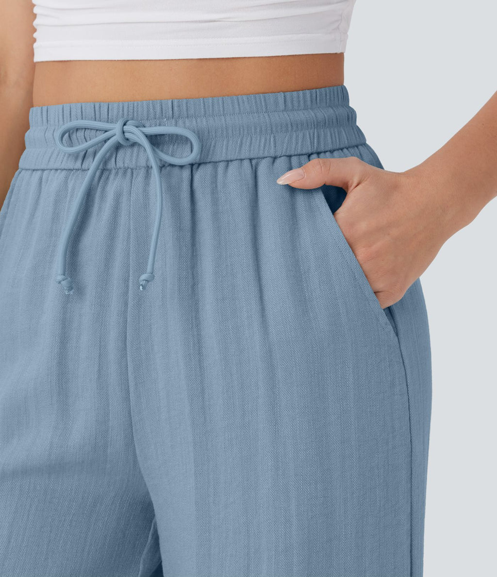 Pantalon large fluide taille haute avec cordon de serrage, poches latérales et aspect lin