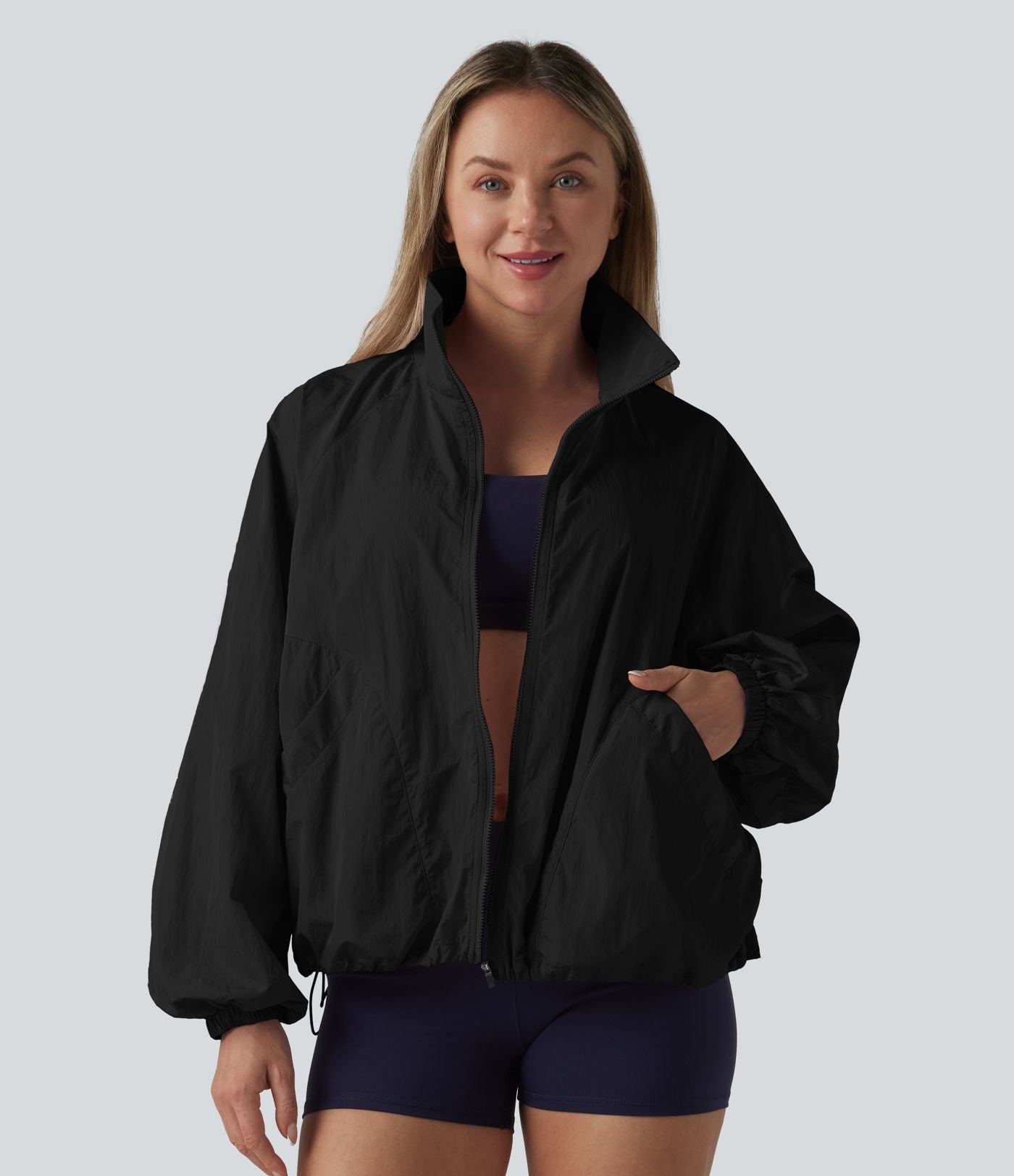 Veste de sport déperlante col montant manches longues zippée avec poches
