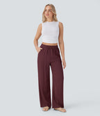 Pantalon large fluide taille haute avec cordon de serrage, poches latérales et aspect lin