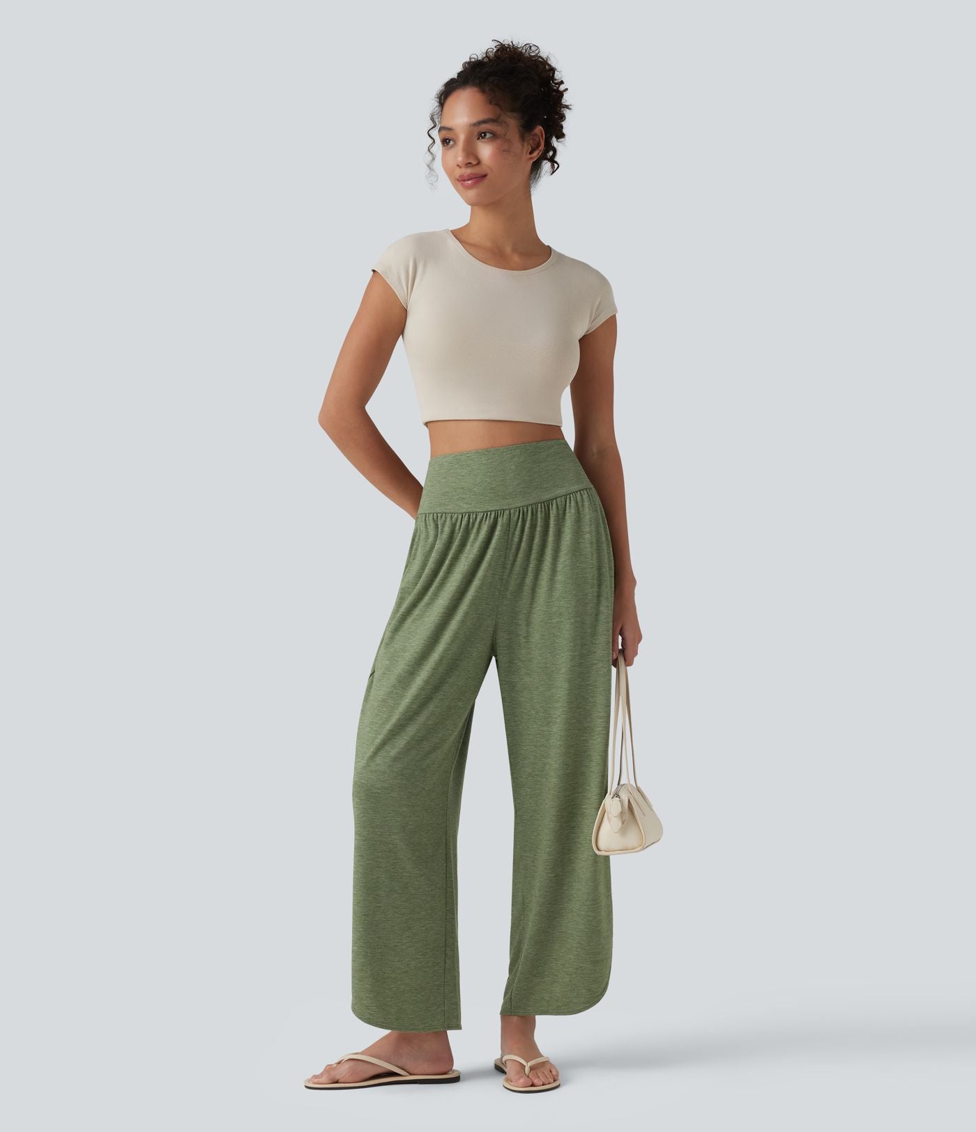 Pantalon décontracté taille haute gainant avec ourlet arrondi et poches