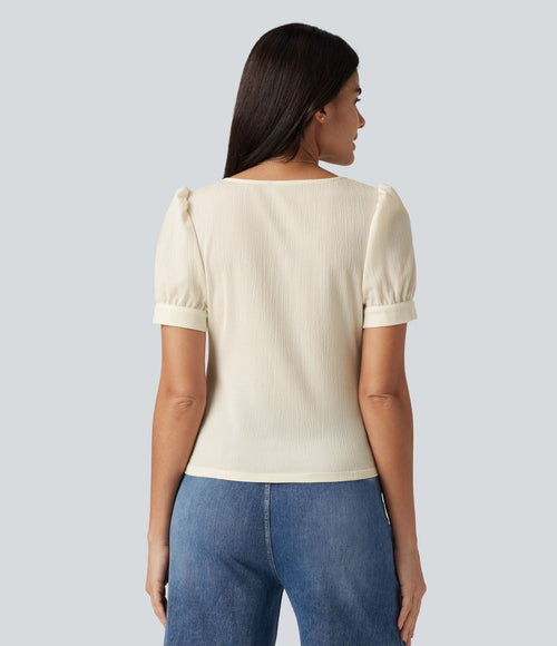 Blouse habillée col carré à manches bouffantes et tissu texturé