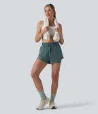 Short running 2-en-1 taille haute avec cordon de serrage et poches