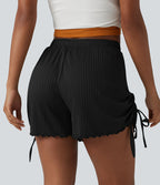 Short en maille côtelée taille mi-haute à cordon de serrage et ourlet ondulé 10 cm avec poches