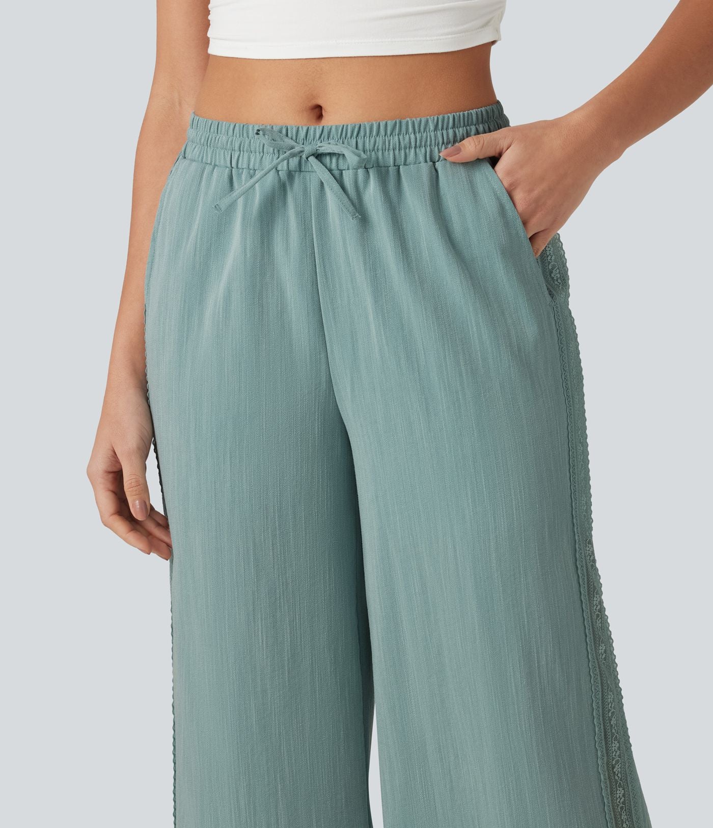 Pantalon large fluide casual 2 en 1 taille mi-haute avec cordon de serrage, dentelle contrastante, poches et aspect lin